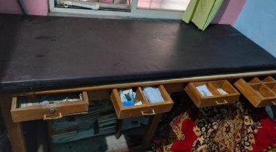 Clinical exam table and medicinal rack